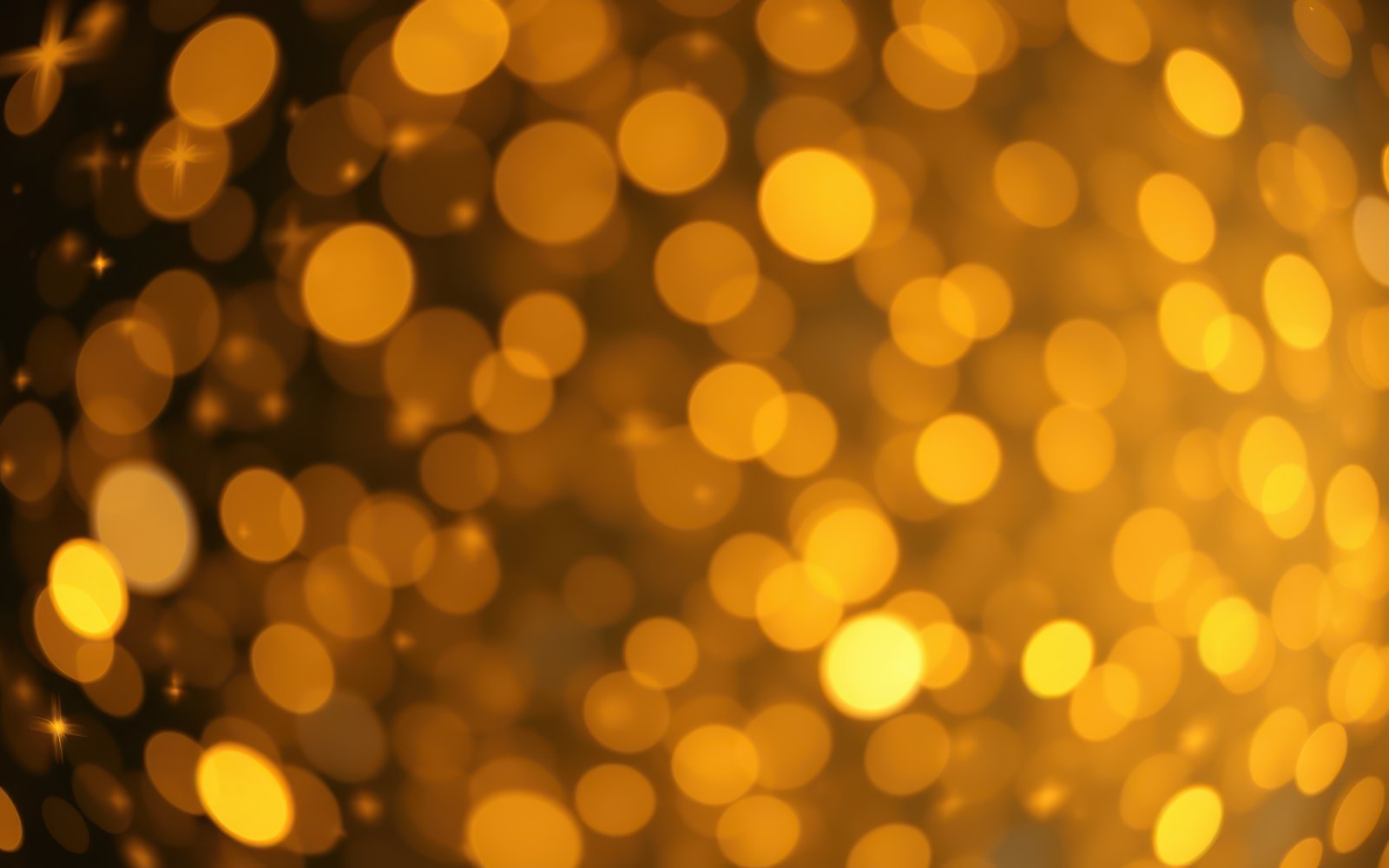 Sparkling golden bokeh light effect creates a warm, festive atmosphere during the evening celebration in an urban setting